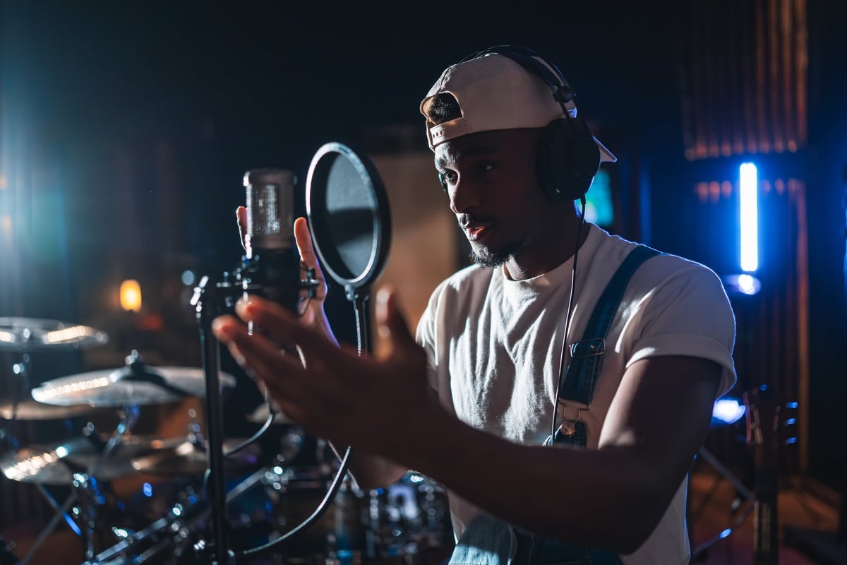 Cardo Van Gogh, Neon Beams artist and songwriter, recording vocals in the studio